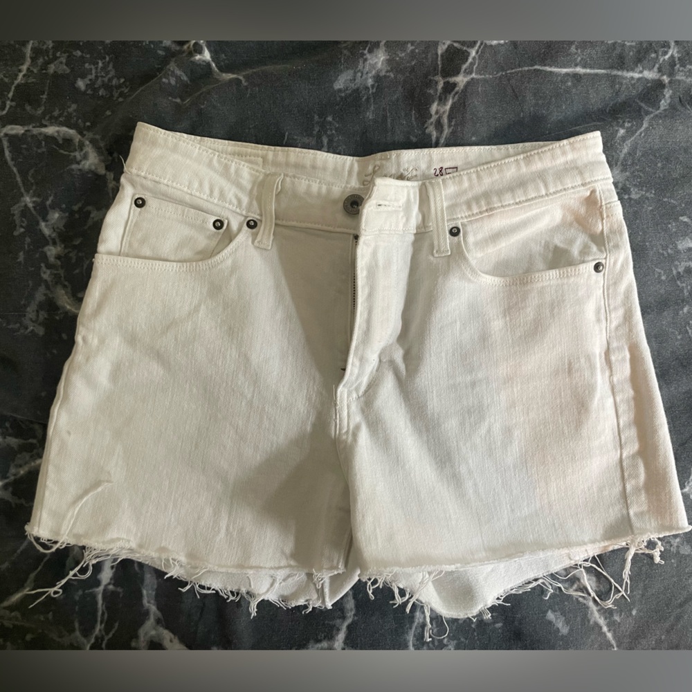 White denim Levi’s cut off shorts